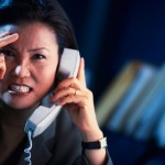Frustrated businesswoman on the phone